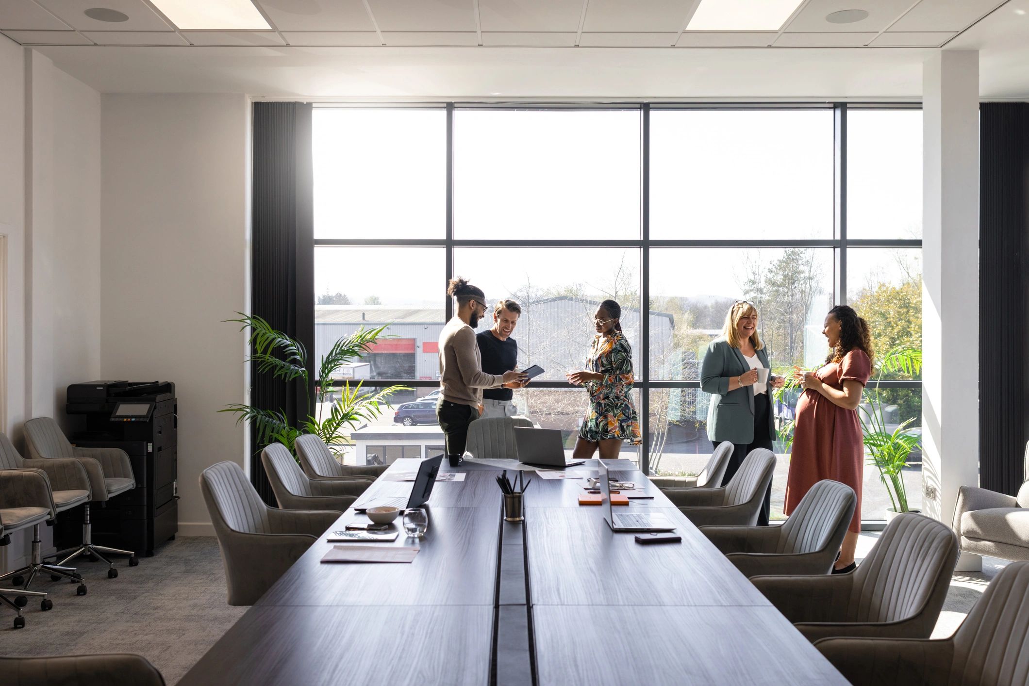 Consulting team discussing strategy in a modern office