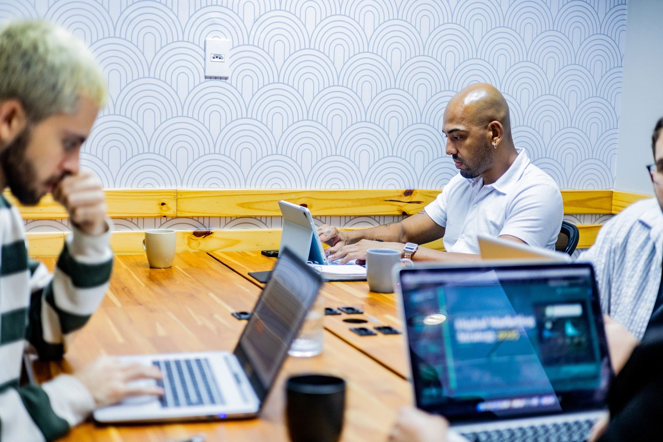 Cybersecurity lead working during a business meeting
